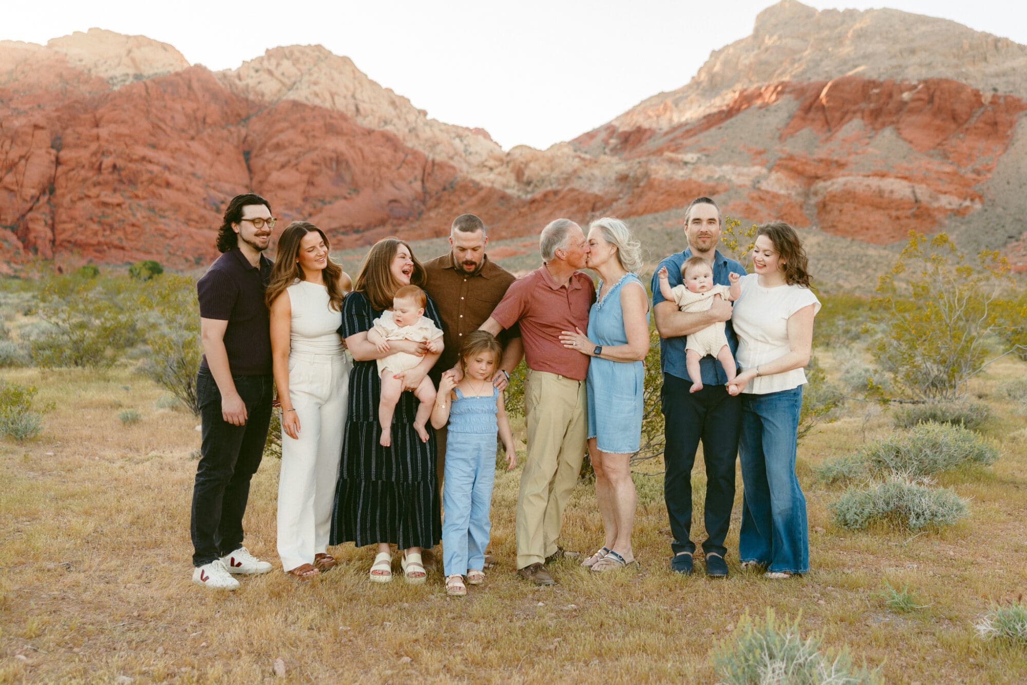 Extended family session Las Vegas with full group in front of red rock formations