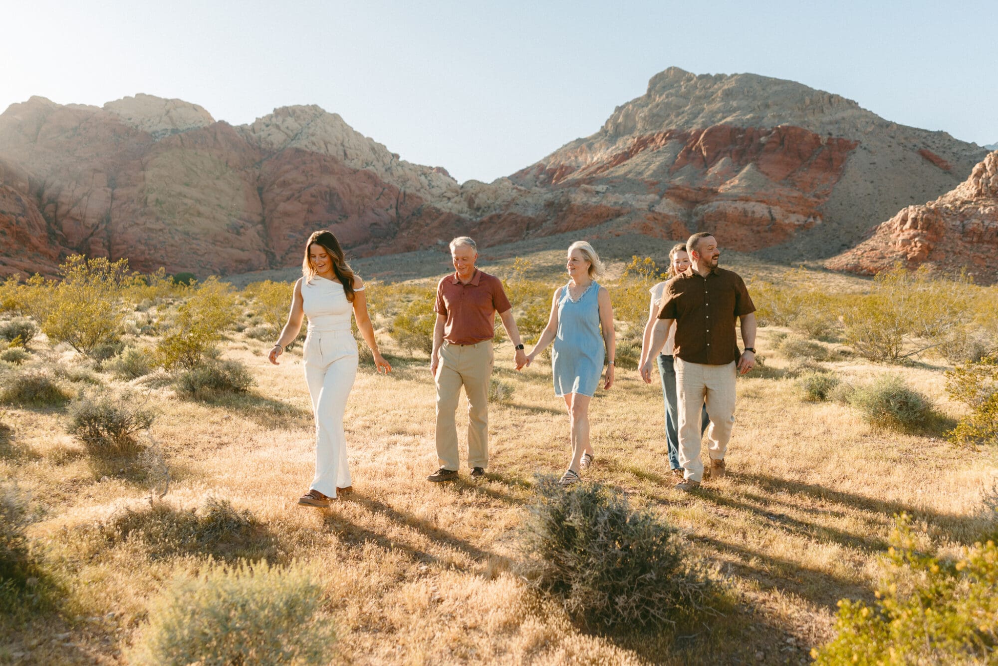 Family walking through desert landscape during Las Vegas extended family session