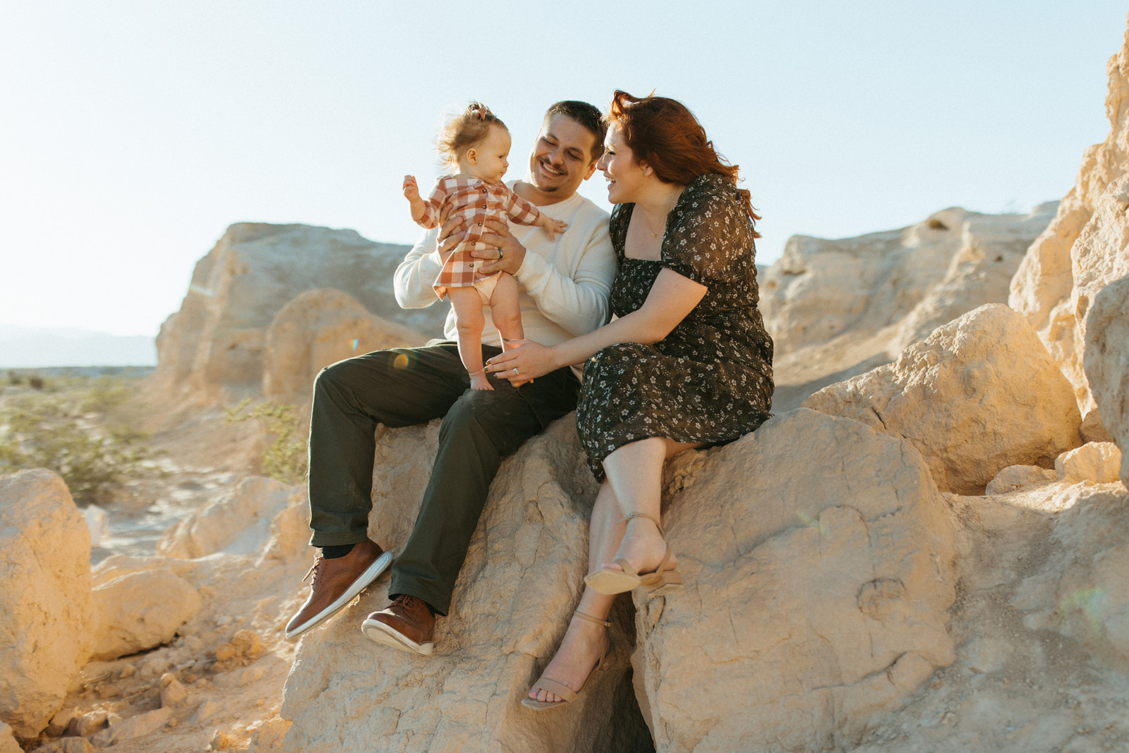 vegas rocky family session, family sittin on a rock together