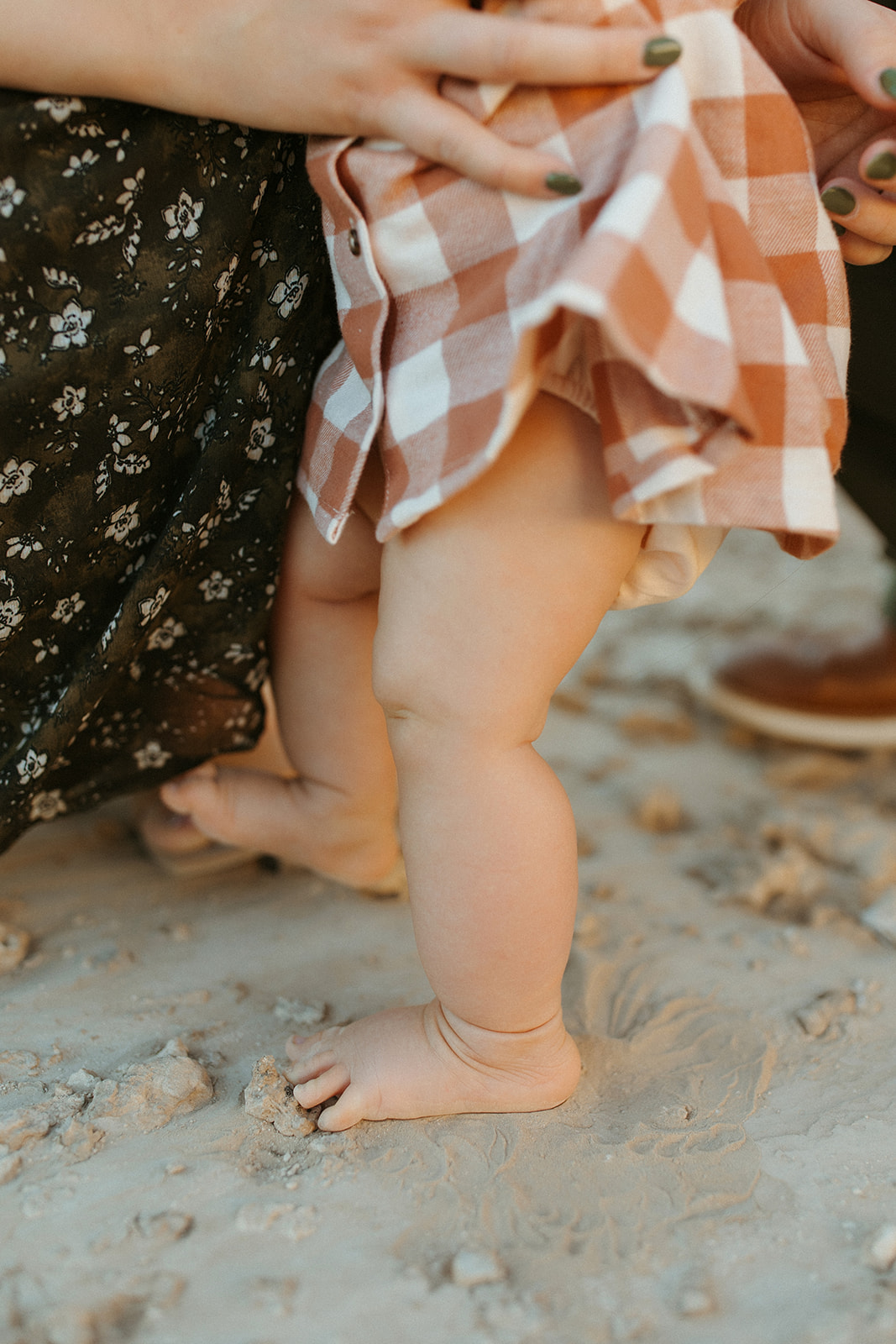 baby girl feet in desert sand