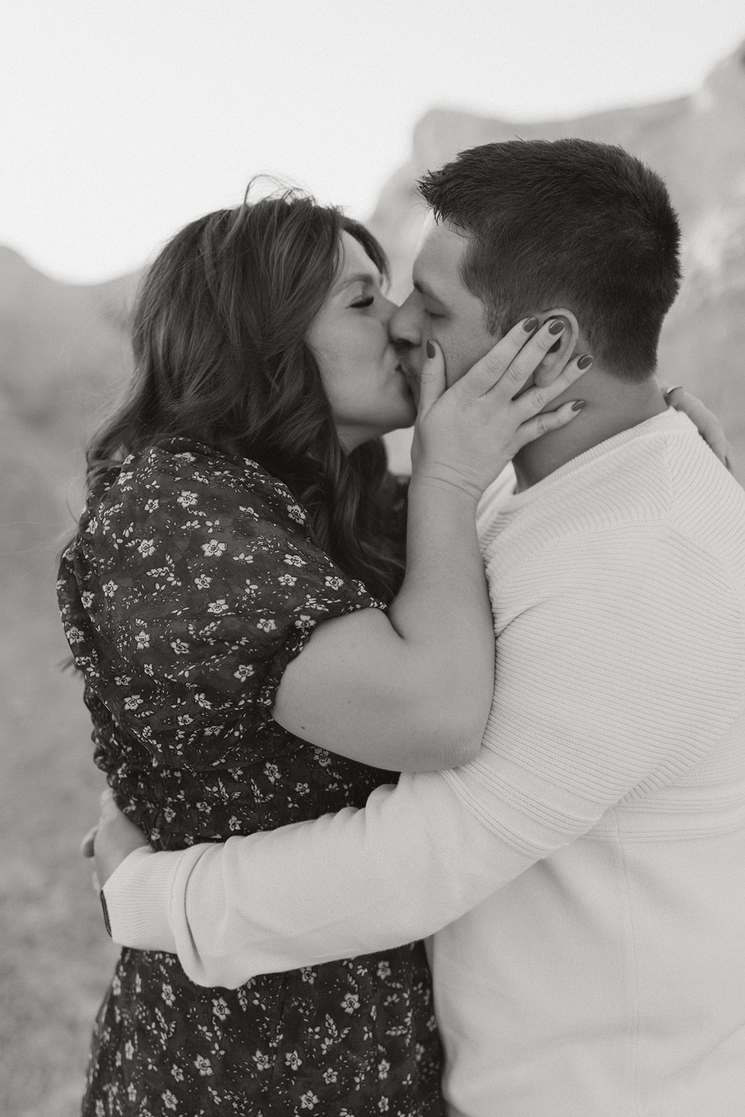 man and women kiss passionately black and white photo