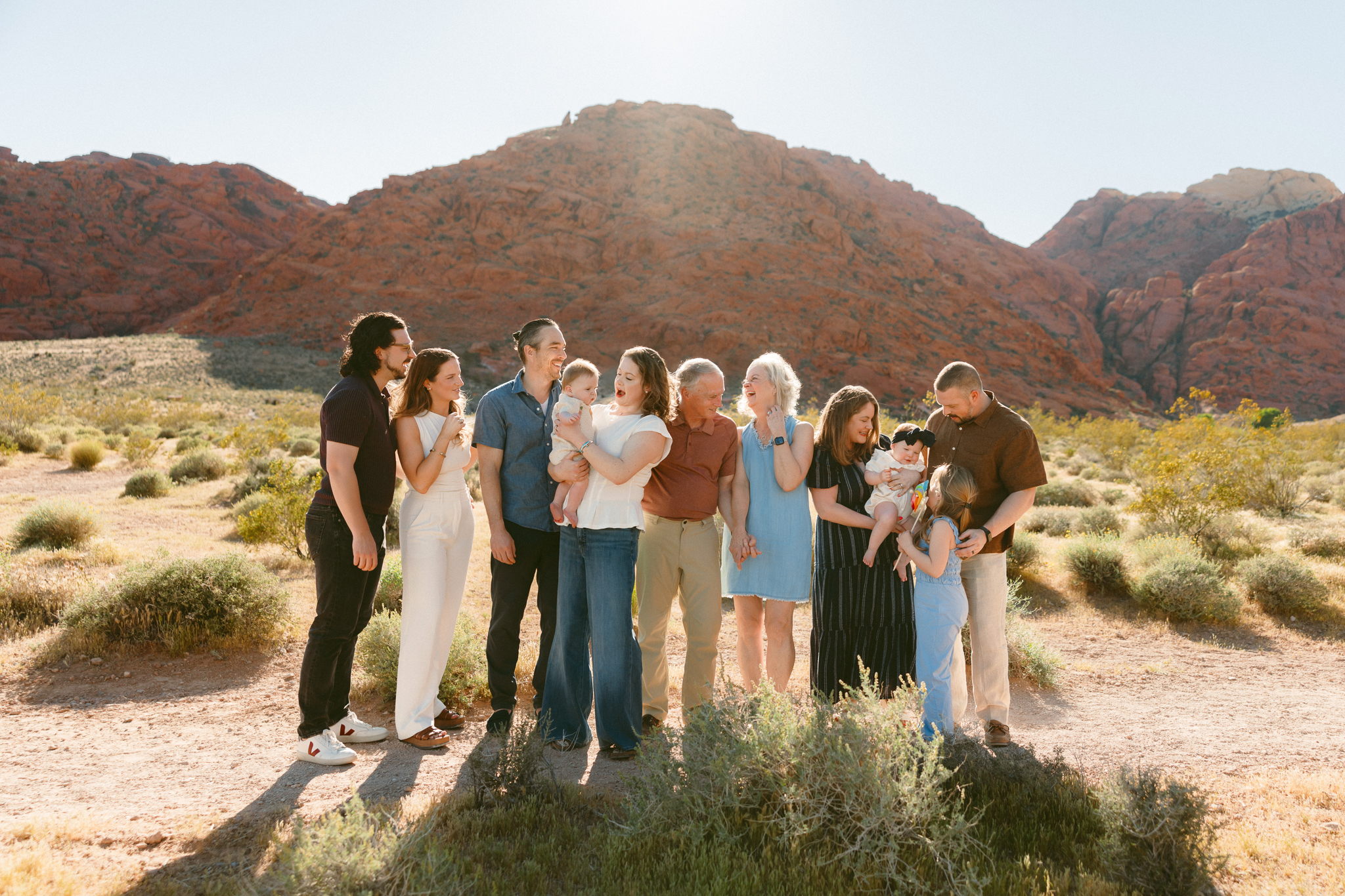 Large family group laughing together during extended family session in Las Vegas